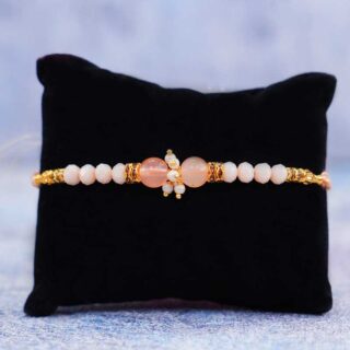pearl-rakhi-with-peace-lily-plant-n-chocolates_2