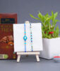 Set of 2 Evil Eye Rakhi with Lucky Plant Combo