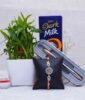 Combo of Rakhi with Lucky Bamboo Plant Chocolates N Pen